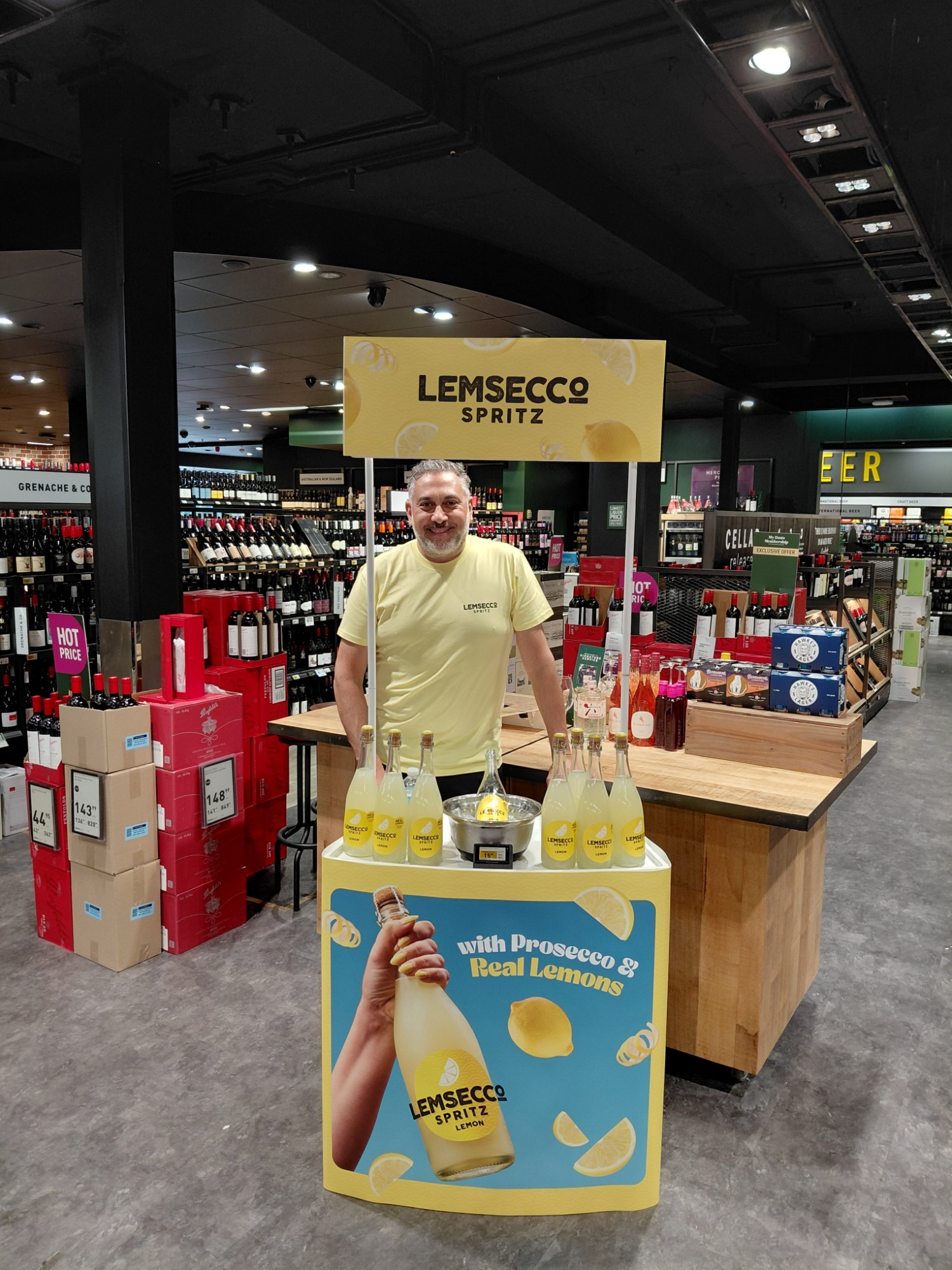 Drinxfactory Brand Ambassador at a branded Lemsecco Spritz tasting station